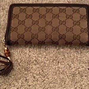 Gucci canvas zip around wallet .Bamboo tassel